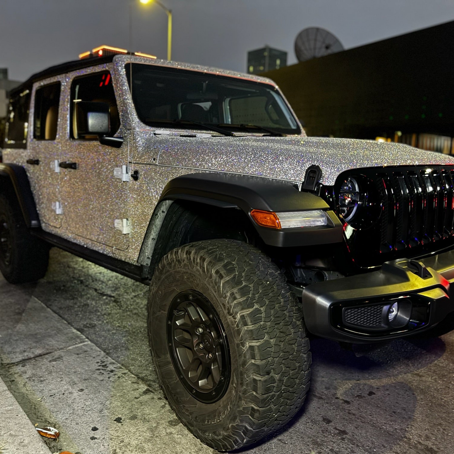 Full vehicle crystal wrap with hand-placed glass crystals reflecting sunlight